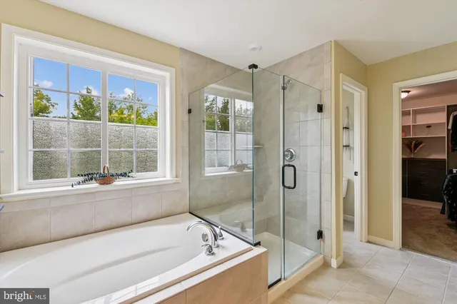 a view of deck with wooden floor and fence with a bench