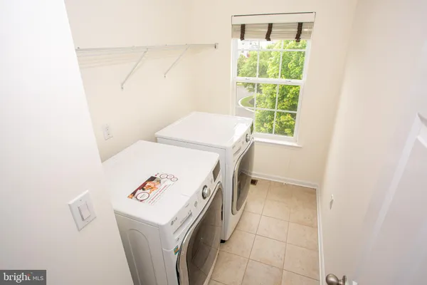 a utility room with a window dryer and washer