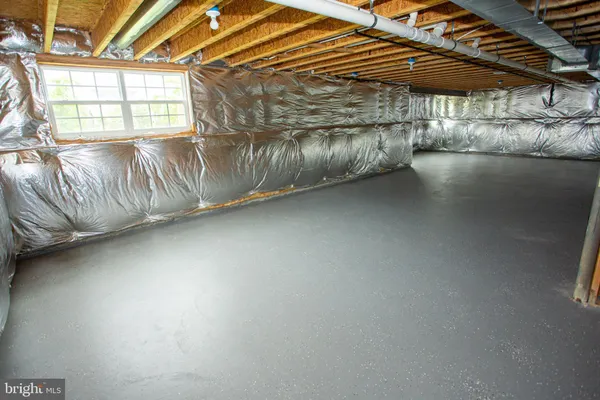 a view of water heater room with a window