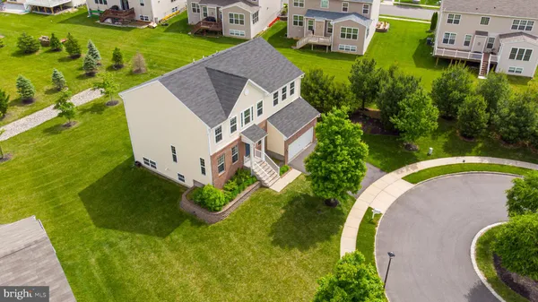 an aerial view of a house with outdoor space pool patio and outdoor seating