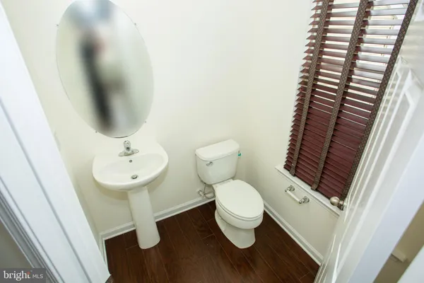 a bathroom with a toilet and a sink