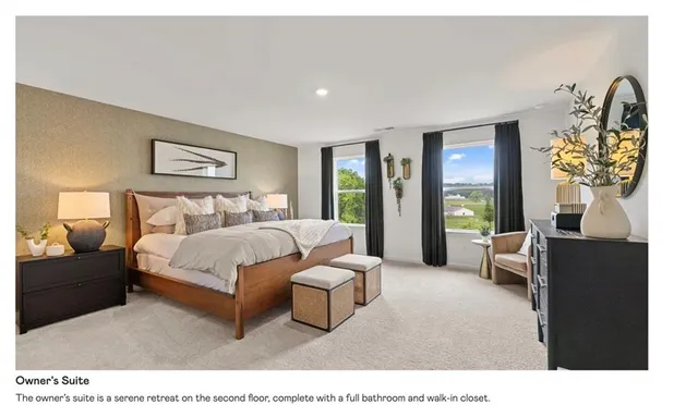 a bedroom with a bed and a couch