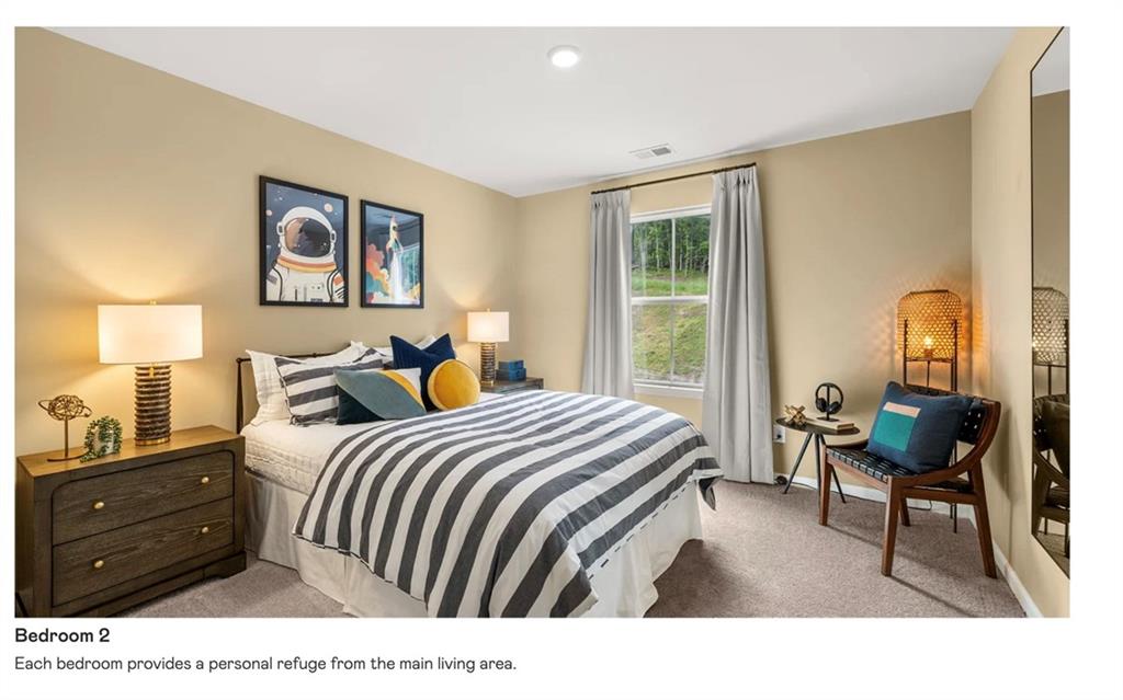 153 Saddlebred Way Rossville, GA 30741 - Photo 24 of 26 a bedroom with a bed a table and chair