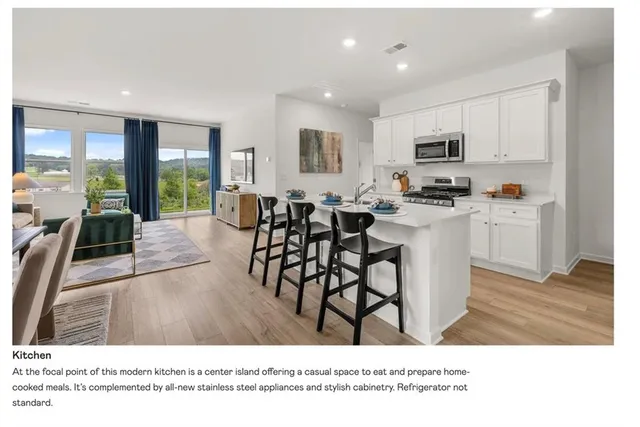 a living room with stainless steel appliances kitchen island granite countertop a stove a sink a dining table and chairs