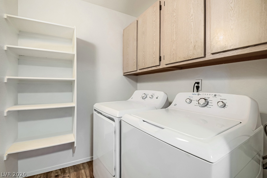 7885 West Flamingo Road, Unit 1003 Las Vegas, NV 89147 - Photo 20 of 22 Ample wooden cabinetry and built-in shelving maximize storage space in this functional utility area.