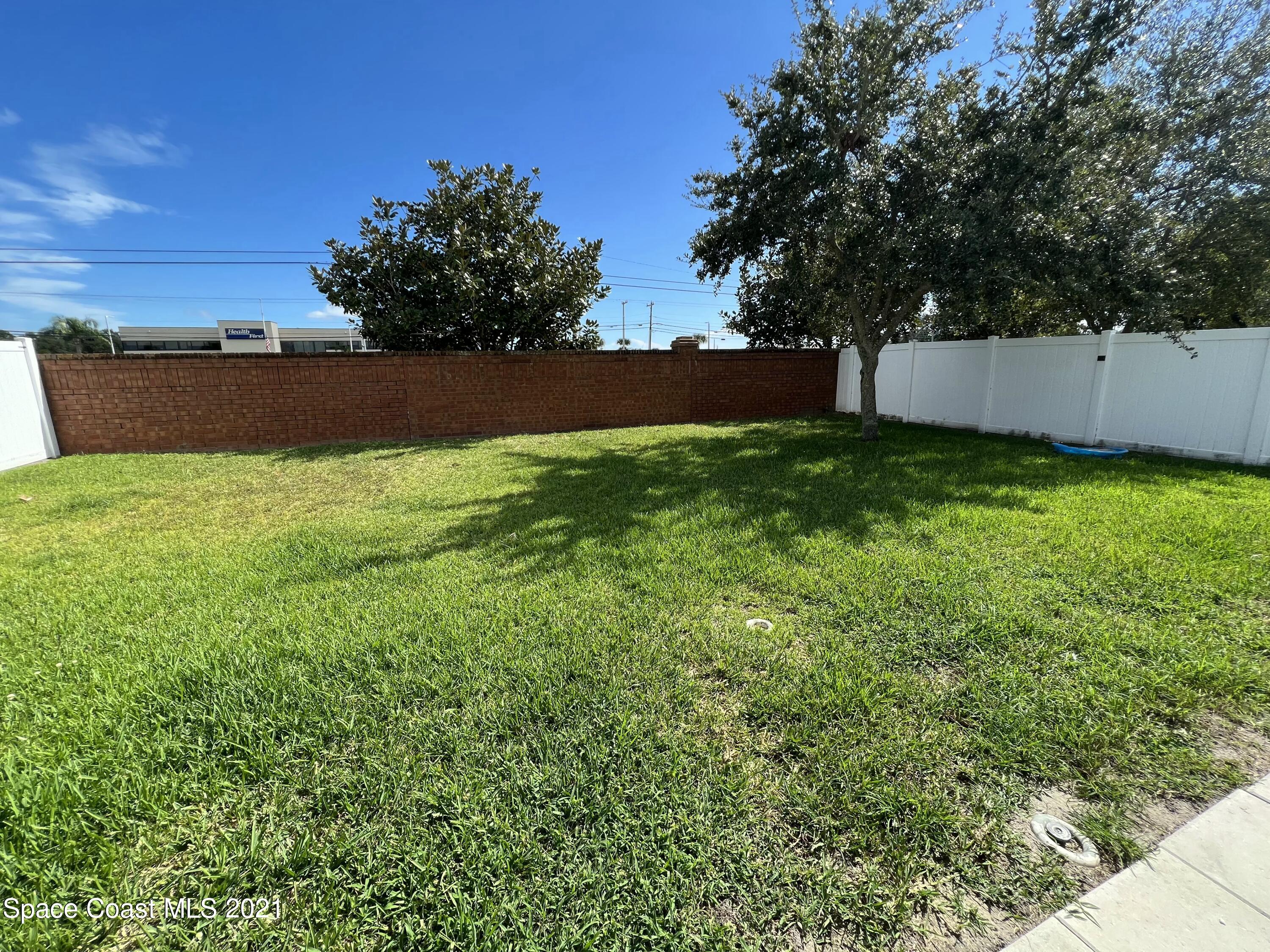 2440 Bridgeport Circle Rockledge, FL 32955 - Photo 22 of 23 a view of backyard with green space