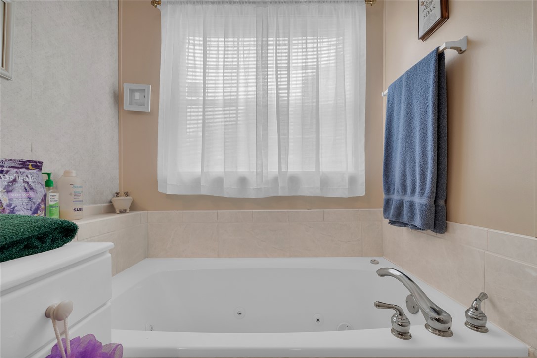 721 Cedar Crest Trail Walhalla, SC 29691 - Photo 18 of 47 Relax and rejuvenate in this inviting jetted tub with tiled surround, illuminated by natural light.