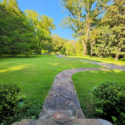 a view of a golf course with a garden