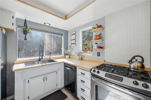 a kitchen with a stove and a sink