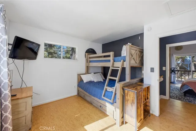 a view of a livingroom with furniture and a flat screen tv