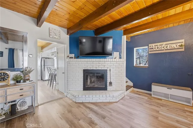 a view of a livingroom with furniture and a fireplace