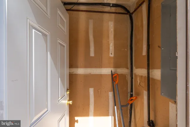 a bathroom with a shower and a glass door