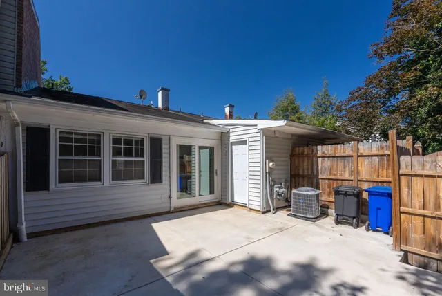 a view of a house with outdoor seating