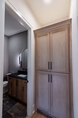 a view of empty room with wooden floor and ceiling fan