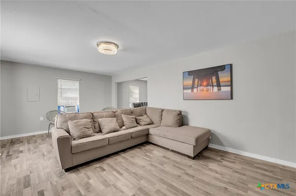 a living room with furniture and a rug
