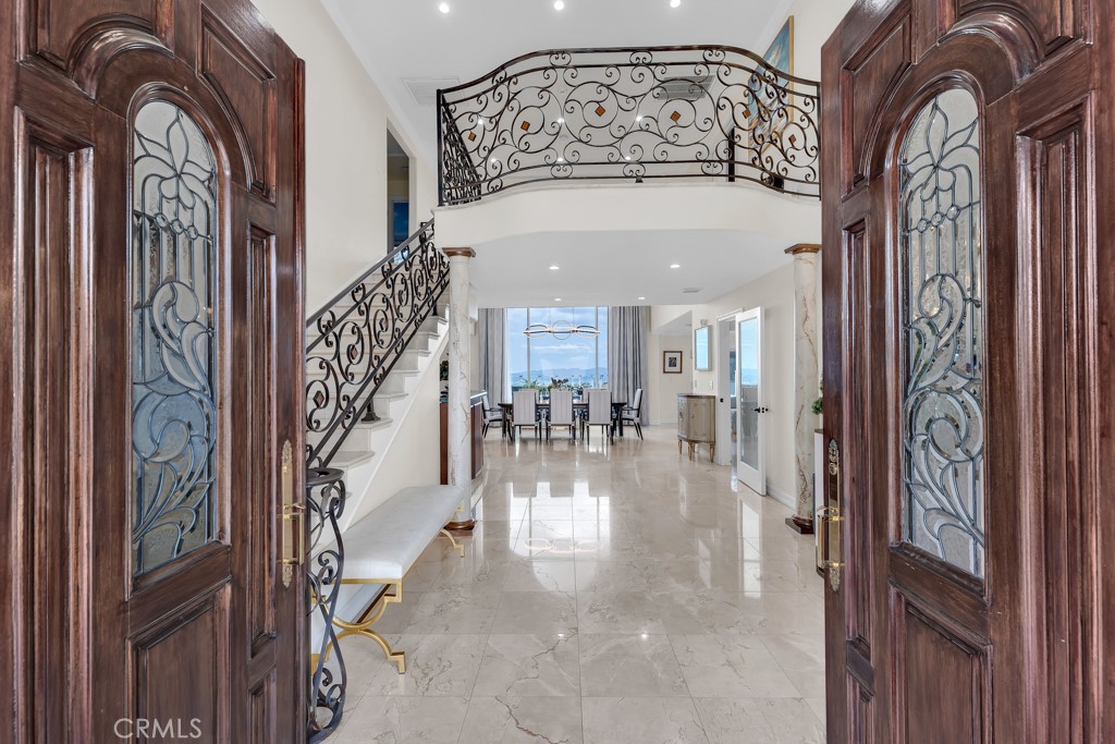 11677 Seminole Circle Porter Ranch, CA 91326 - Photo 17 of 69 a view of staircase with a large mirror and a chandelier