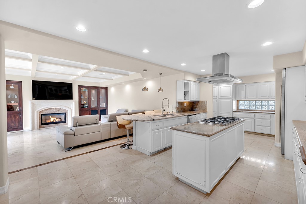 11677 Seminole Circle Porter Ranch, CA 91326 - Photo 24 of 69 a kitchen with a sink stove and cabinets