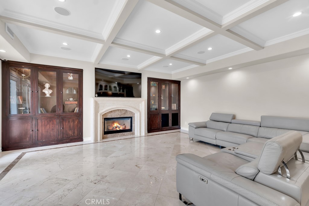 11677 Seminole Circle Porter Ranch, CA 91326 - Photo 29 of 69 a living room with furniture a fireplace and a flat screen tv