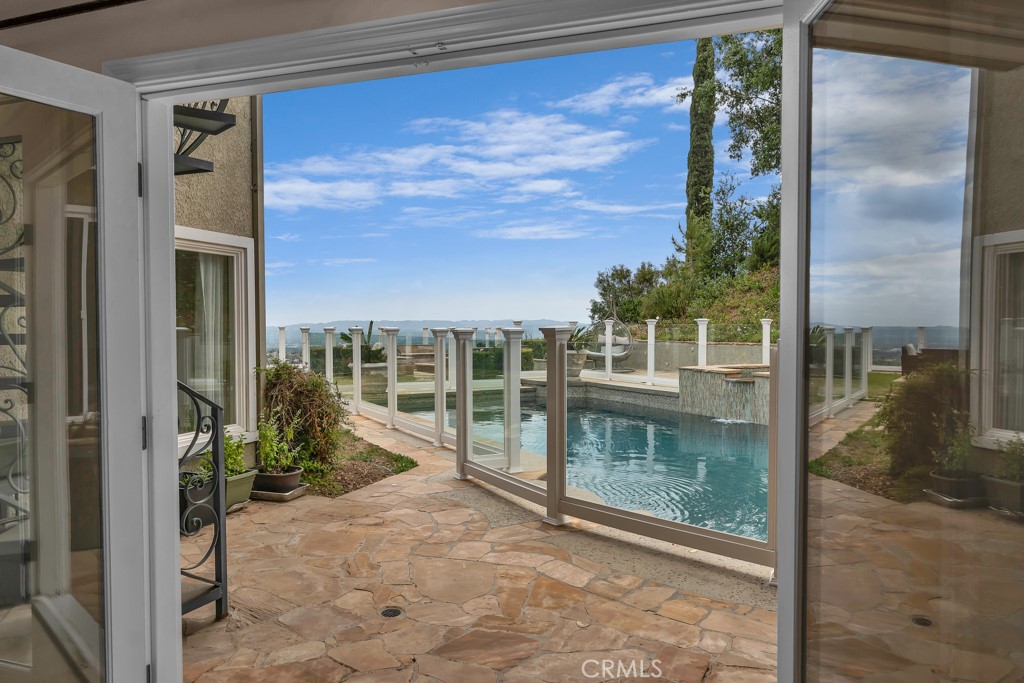 11677 Seminole Circle Porter Ranch, CA 91326 - Photo 30 of 69 a view of a glass door with a yard