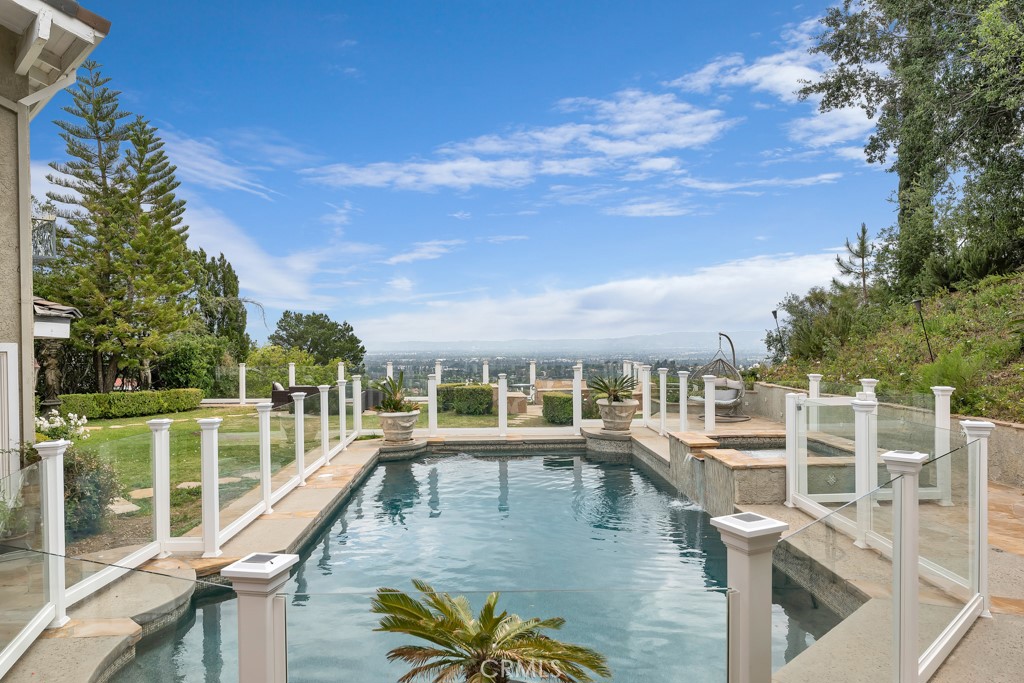 11677 Seminole Circle Porter Ranch, CA 91326 - Photo 35 of 69 a view of a swimming pool with an outdoor seating