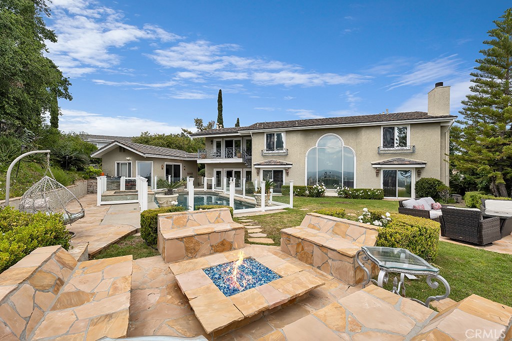 11677 Seminole Circle Porter Ranch, CA 91326 - Photo 39 of 69 a view of a house with swimming pool and sitting area