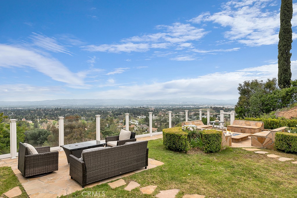 11677 Seminole Circle Porter Ranch, CA 91326 - Photo 42 of 69 a view of a swimming pool with couches and lounge chairs