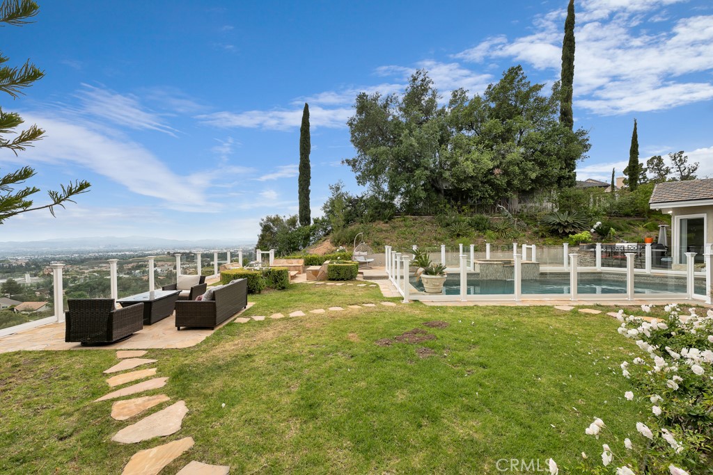 11677 Seminole Circle Porter Ranch, CA 91326 - Photo 43 of 69 a view of a house with a swimming pool