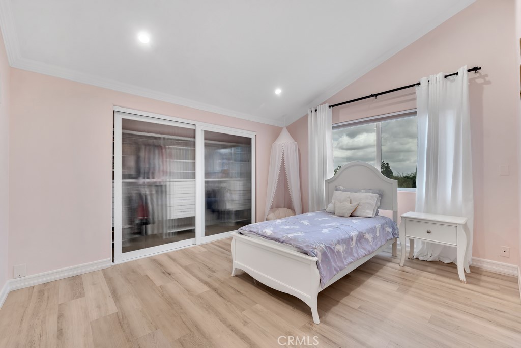 11677 Seminole Circle Porter Ranch, CA 91326 - Photo 61 of 69 a bedroom with a bed and a window