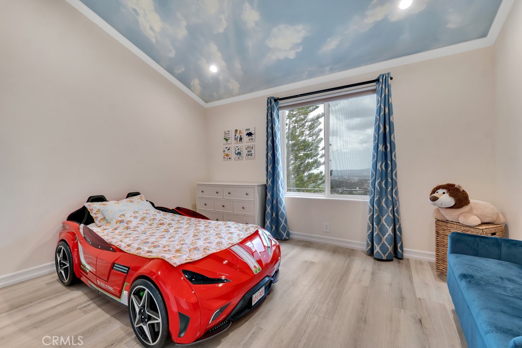 11677 Seminole Circle Porter Ranch, CA 91326 - Photo 63 of 69 a room with a bed and a window