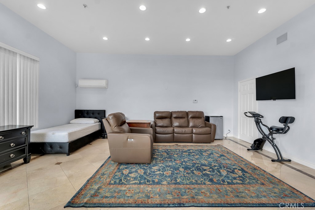 11677 Seminole Circle Porter Ranch, CA 91326 - Photo 66 of 69 a living room with furniture and a flat screen tv