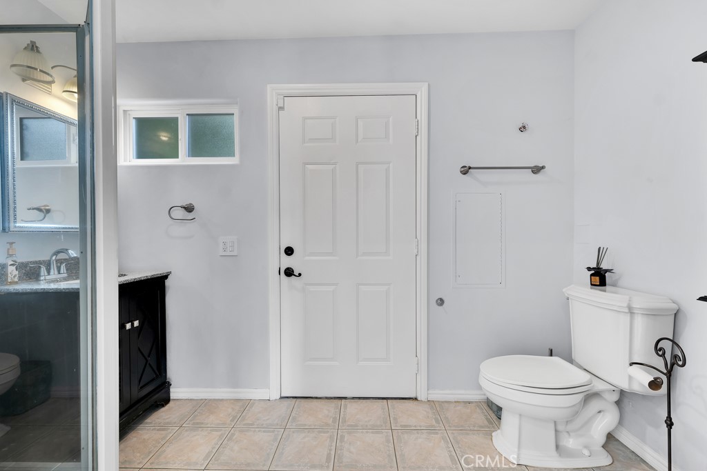 11677 Seminole Circle Porter Ranch, CA 91326 - Photo 69 of 69 a bathroom with a toilet and a shower