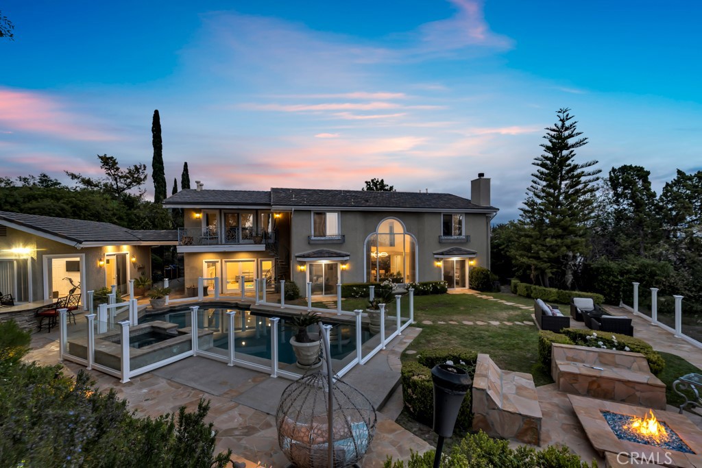 11677 Seminole Circle Porter Ranch, CA 91326 - Photo 7 of 69 a view of a house with backyard porch and sitting area