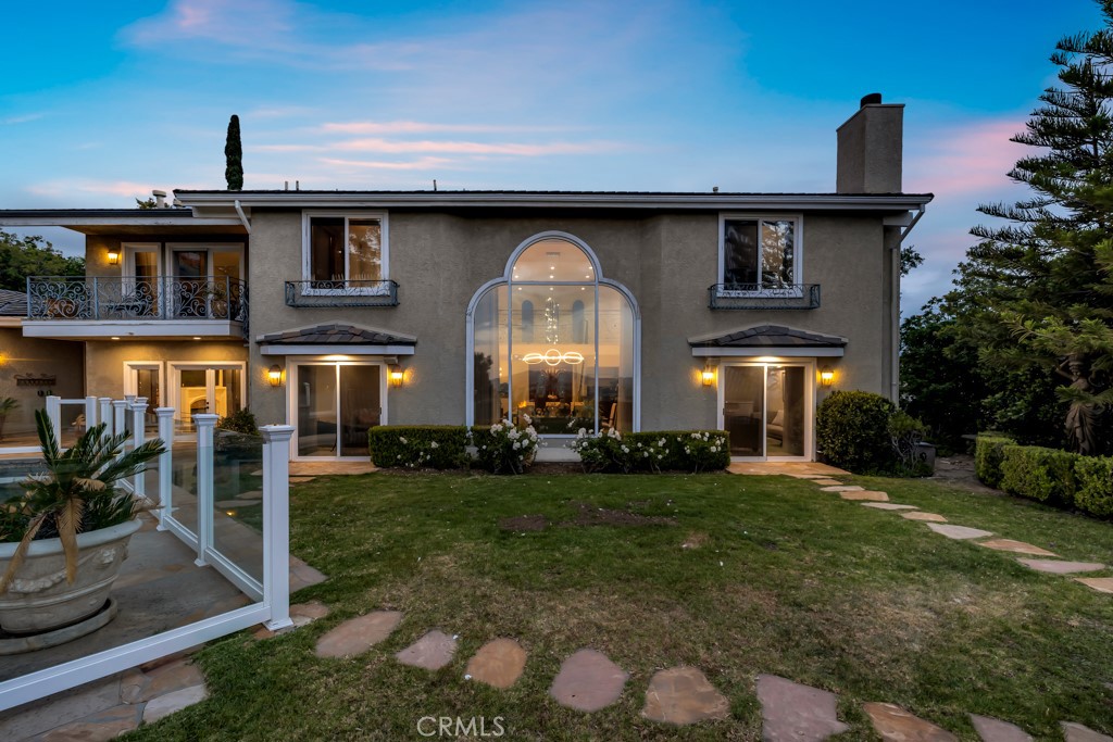 11677 Seminole Circle Porter Ranch, CA 91326 - Photo 9 of 69 a front view of a house with a yard