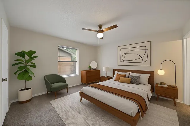 a bedroom with bed and a couch