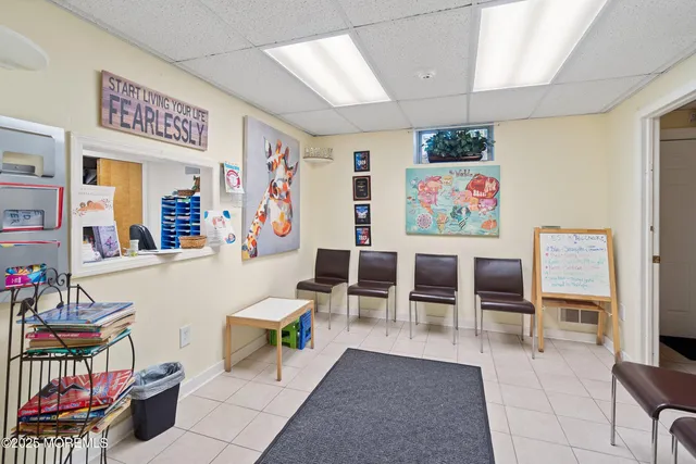 a living room with furniture a rug and a table