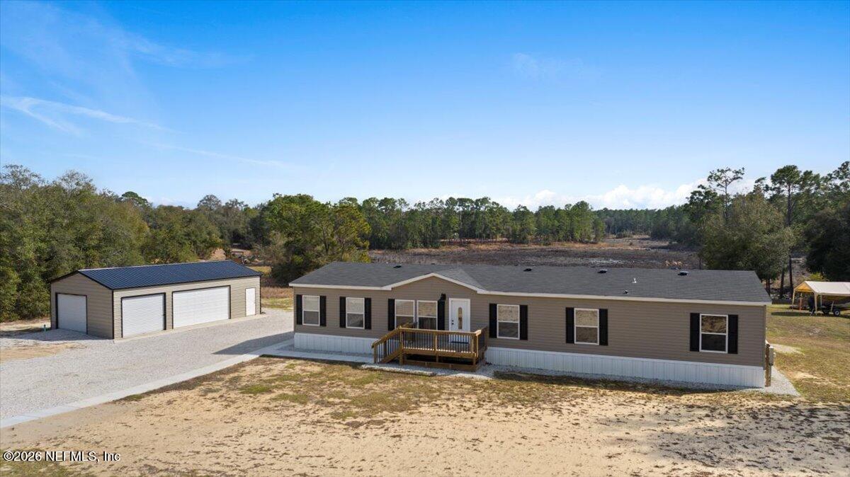 5533 Coronado Street Keystone Heights, FL 32656 - Photo 16 of 73 front view of a house with a yard