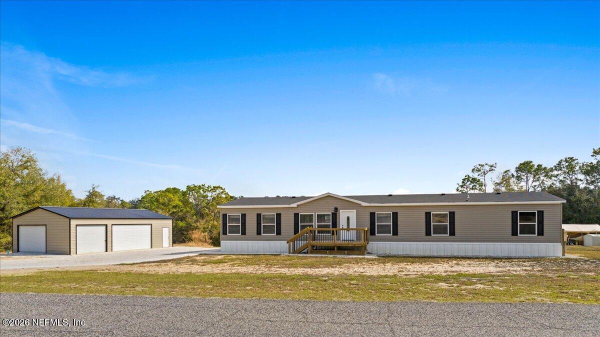 5533 Coronado Street Keystone Heights, FL 32656 - Photo 2 of 73 a view of a house with a swimming pool