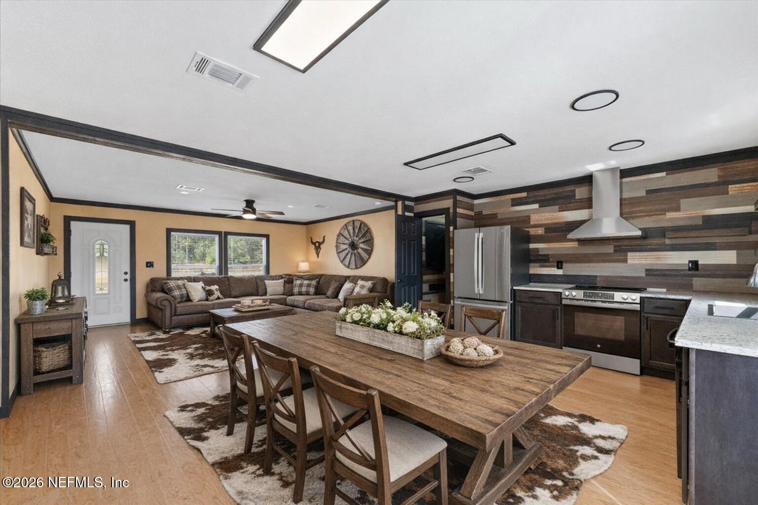 5533 Coronado Street Keystone Heights, FL 32656 - Photo 22 of 73 a view of a dining room with furniture window and wooden floor