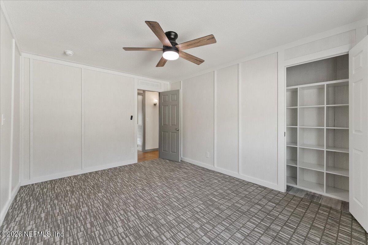 5533 Coronado Street Keystone Heights, FL 32656 - Photo 38 of 73 a view of an empty room with a ceiling fan