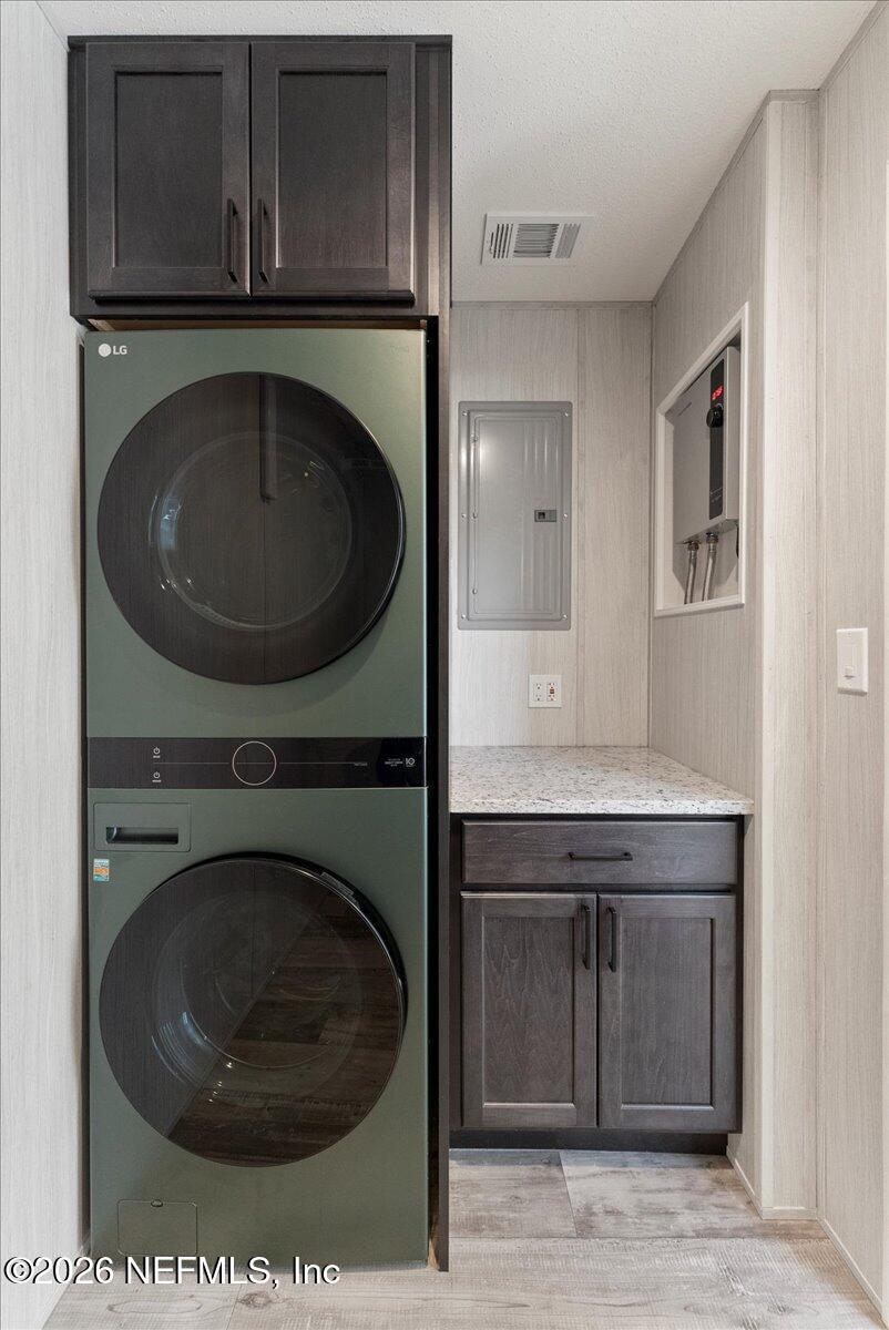 5533 Coronado Street Keystone Heights, FL 32656 - Photo 56 of 73 a bathroom with a sink and a washer dryer