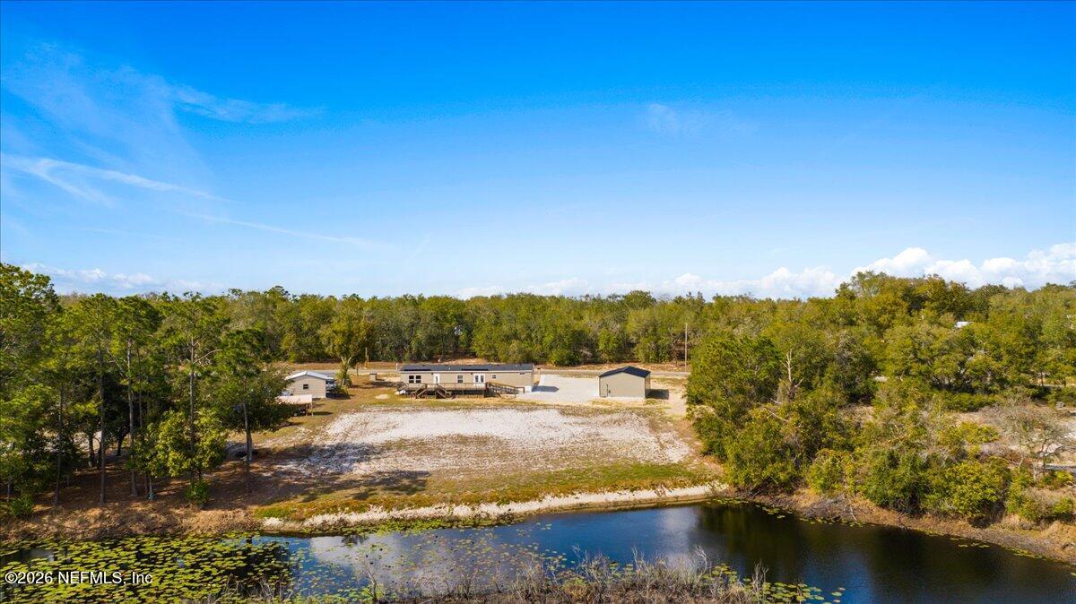 5533 Coronado Street Keystone Heights, FL 32656 - Photo 71 of 73 a view of a lake with houses in the back