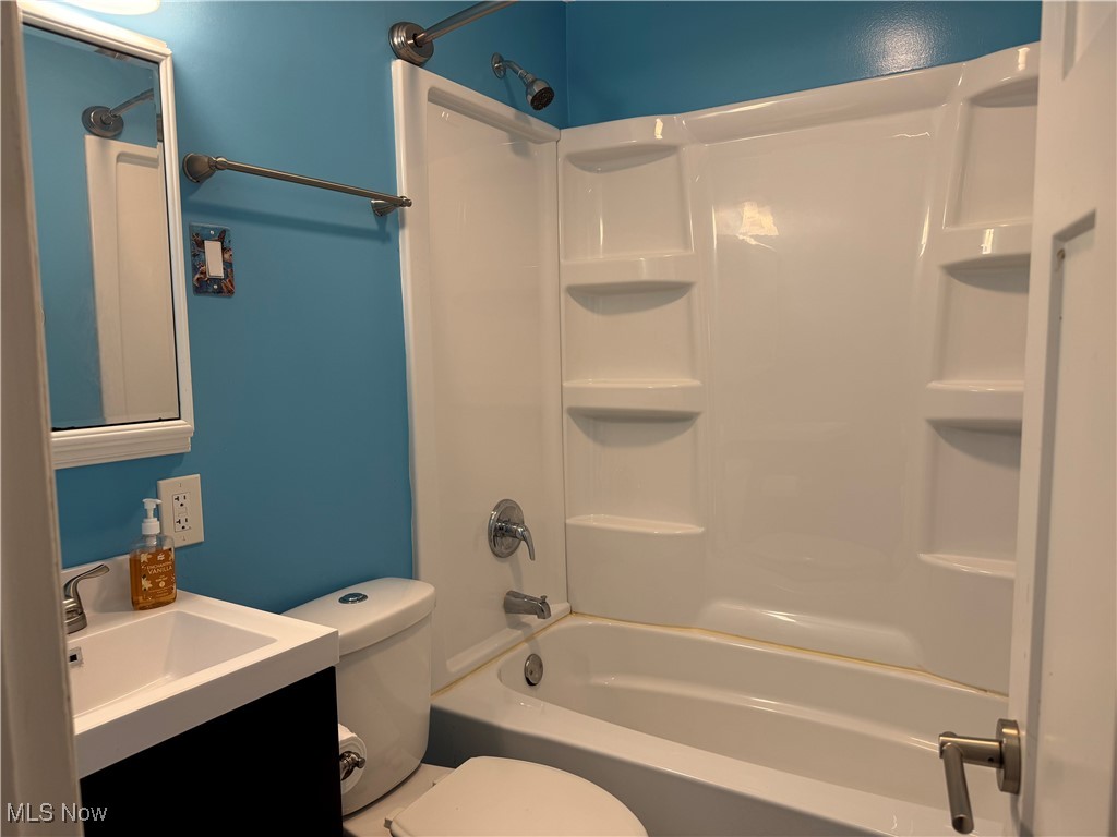 1139 Kessel Avenue Akron, OH 44310 - Photo 24 of 36 Bathroom featuring toilet, vanity, and bathing tub / shower combination