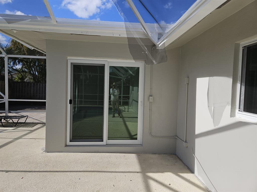 22761 Neptune Road Boca Raton, FL 33428 - Photo 11 of 14 a view of a door and a window