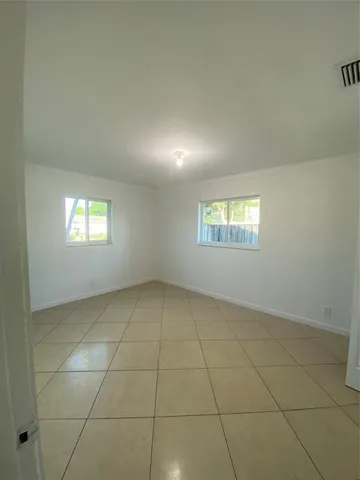 a bathroom with a toilet sink and shower