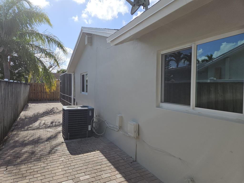 22761 Neptune Road Boca Raton, FL 33428 - Photo 9 of 14 a view of a house with a bench