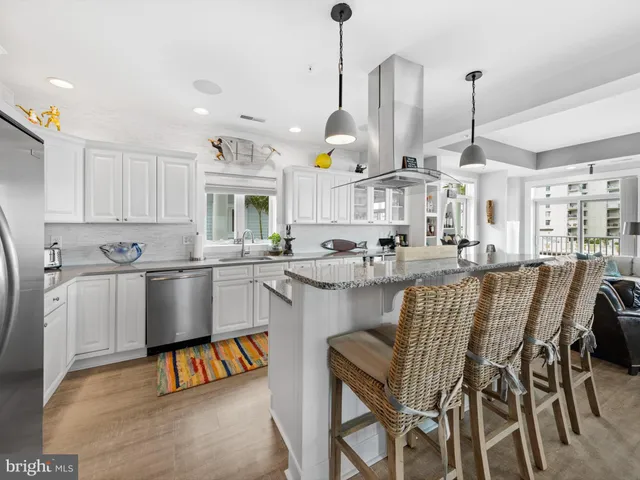 a kitchen with counter top space cabinets and appliances