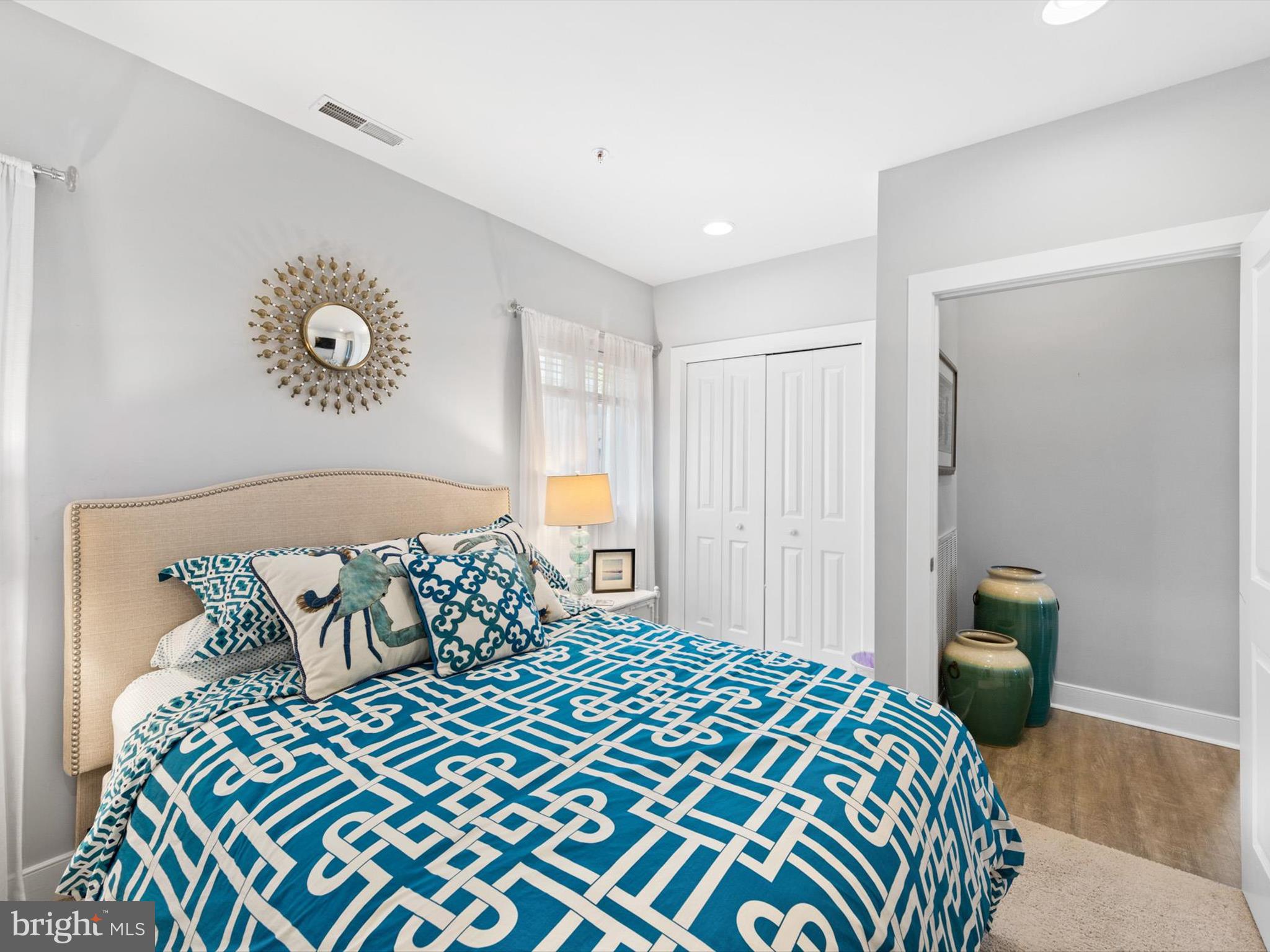 5 87th Street, Unit 303 Ocean City, MD 21842 - Photo 21 of 49 a bedroom with a bed and a table