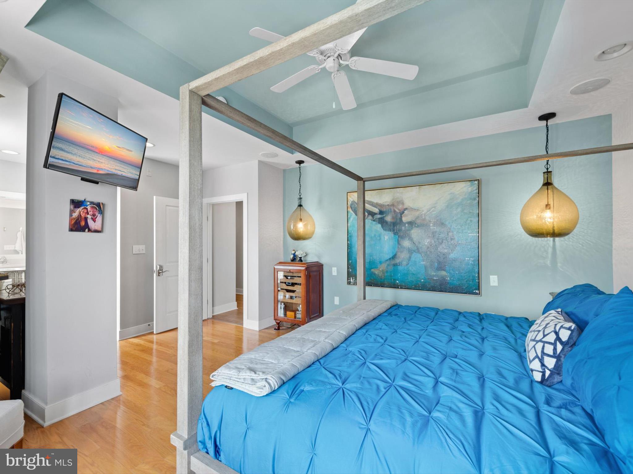 5 87th Street, Unit 303 Ocean City, MD 21842 - Photo 24 of 49 a bedroom with a bed and a chandelier