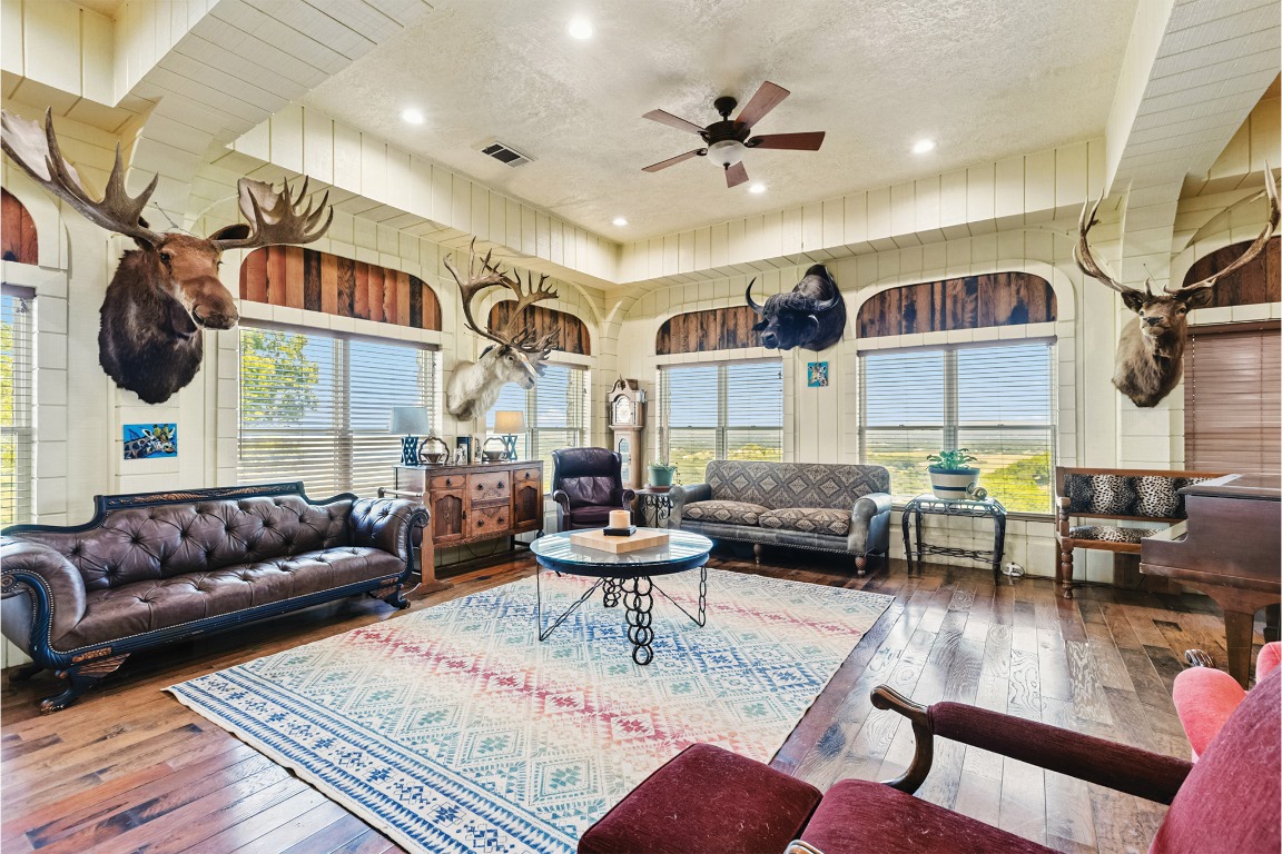 10771 Highway 6 Meridian, TX 76665 - Photo 13 of 40 a living room with furniture ceiling fan and a rug