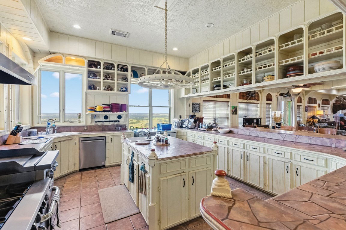 10771 Highway 6 Meridian, TX 76665 - Photo 20 of 40 a kitchen with a sink stove and cabinets